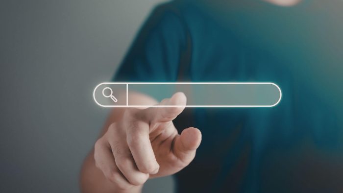 A person pointing to a floating search bar