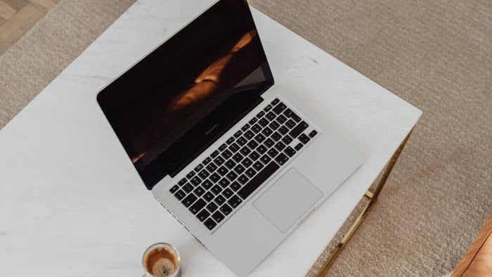 Open laptop shot from above on a white table